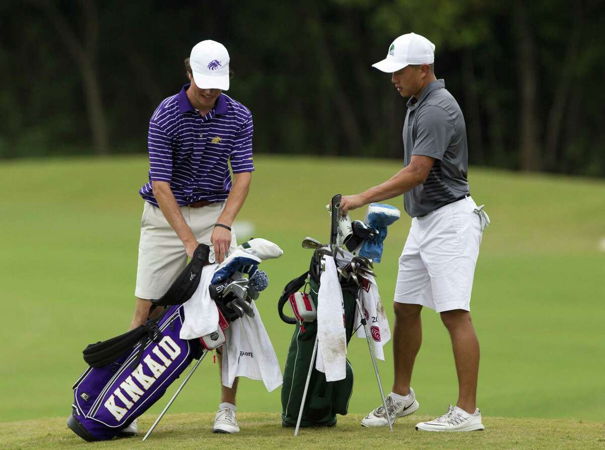 Ben Wong of John Cooper, right, sets his bag beside with Cole Hammer of Kinkaid near the 18th green during the final round of the Southwest Preparatory Conference Championships at Woodforest Golf Club, Tuesday, May 1, 2018, in Montgomery.