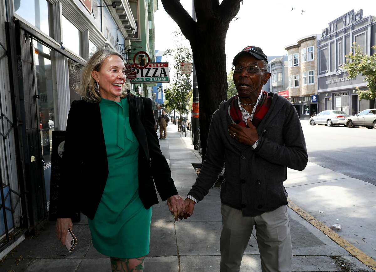New San Francisco D5 supervisor Vallie Brown, left, talks to resident Paul Willis, 76, as they walk through Lower Haight in San Francisco, Cali. on Thursday, July 19, 2018.