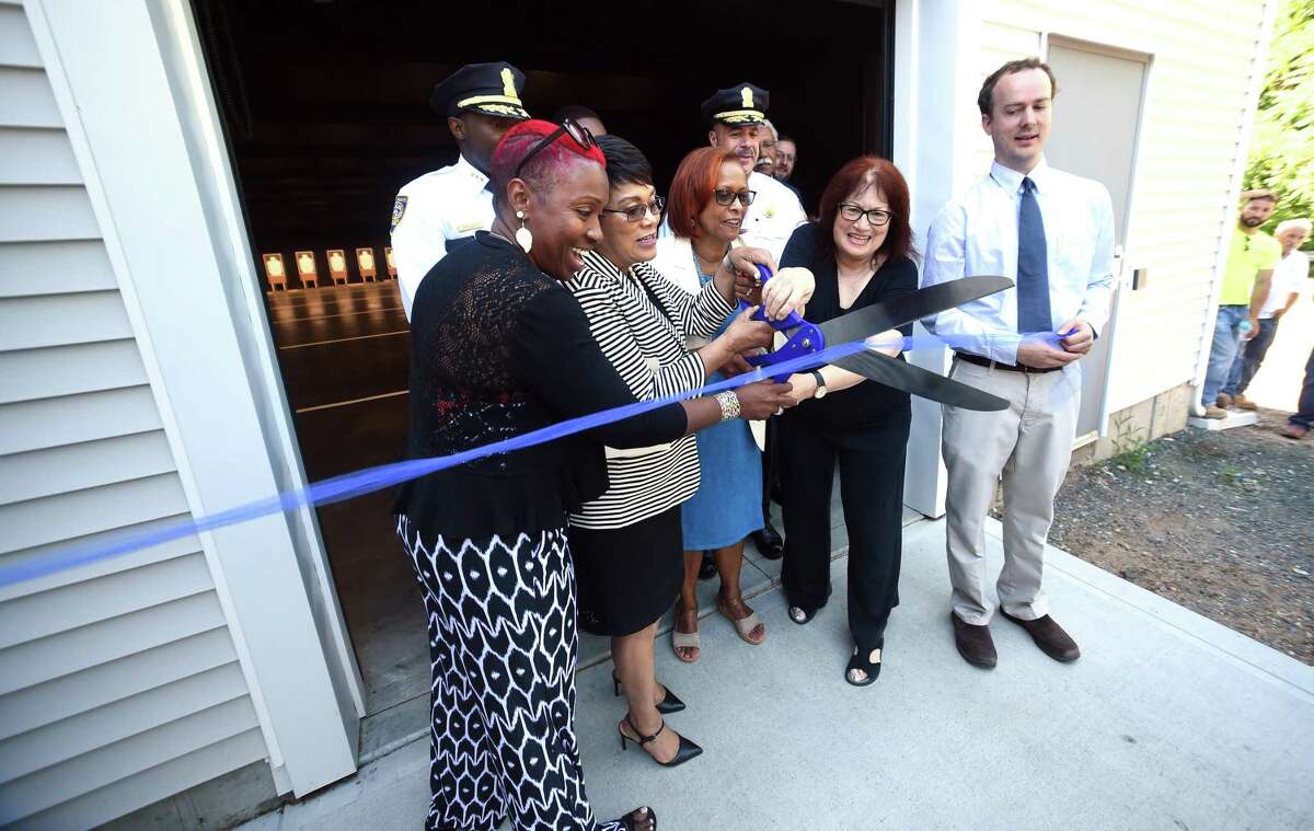From left, state Rep. Robyn Porter, New Haven Mayor Toni Harp, state Rep. Toni Walker and Francine Caplan, chairpwoman of the firing range committee, cut the ribbon at the New Haven Police Department’s new indoor firing and training center on Wintergreen Avenue in New Haven Friday. At right is City Engineer Giovanni Zinn.