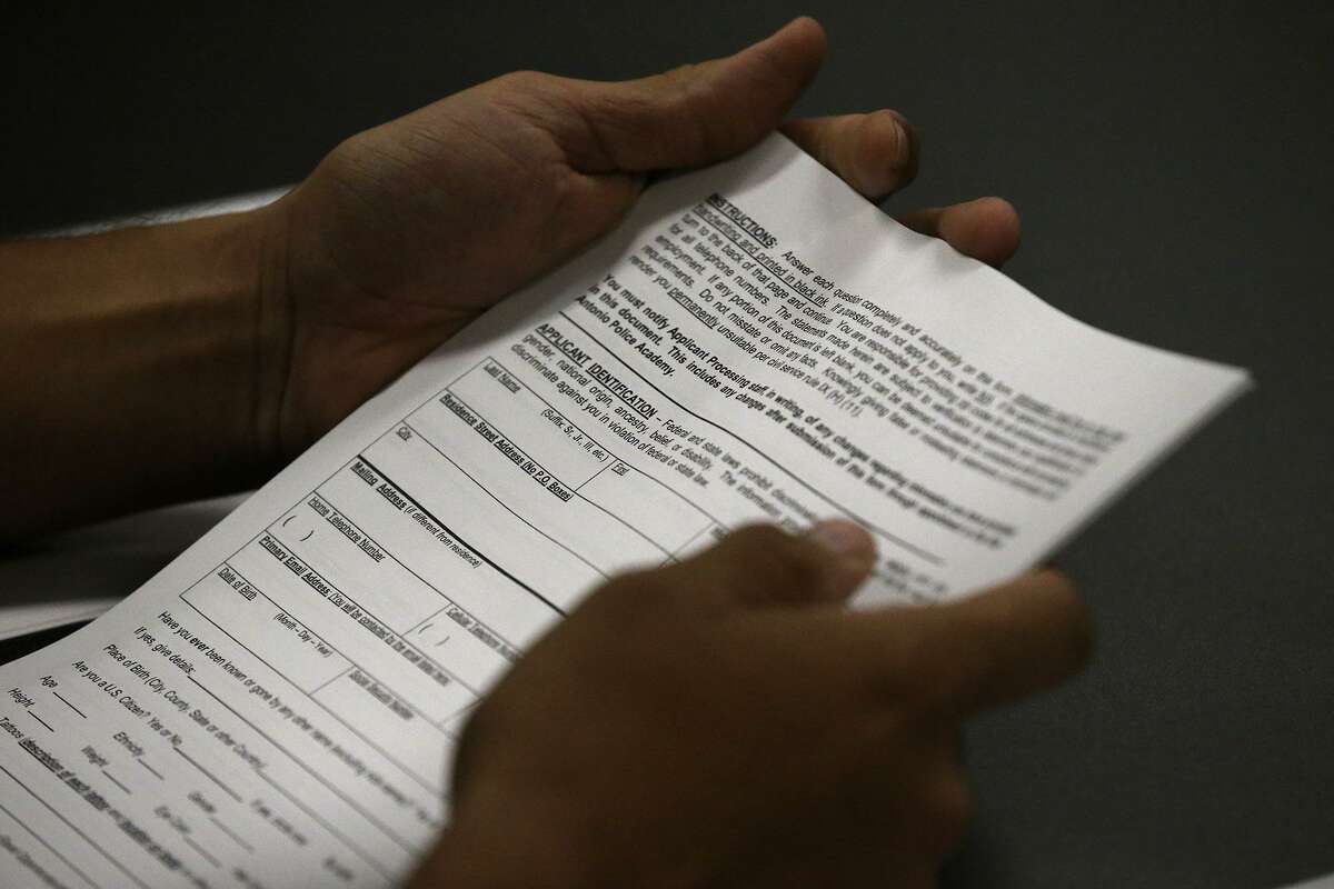 An applicant to the San Antonio Police Department's training academy holds paperwork Tuesday August 15, 2017 during a workshop about the application process. The statewide unemployment rate for June was 4 percent, the same as the overall U.S. rate, according to the Bureau of Labor Statistics. The Texas unemployment rate in May was 4.1 percent.