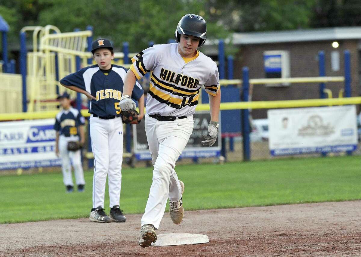 Milford's Zach Worzel rounds the bases after hitting a game winning homerun in the fifth inning against Weston in a Section 1 Little League baseball tournament at Drotar Park on July 20, 2018 in Stamford, Connecticut. Milford won 5-4.