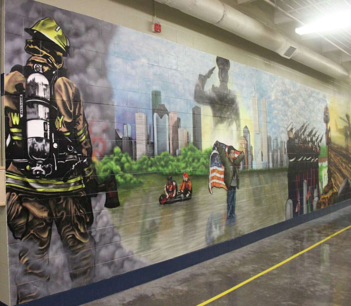 A mural lines one of the halls of the Cleveland Correctional Center. The mural was created by former inmate Anthony Rose and depicts a tribute to the United States military, First Responders, victims of Hurricane Harvey and 9/11.