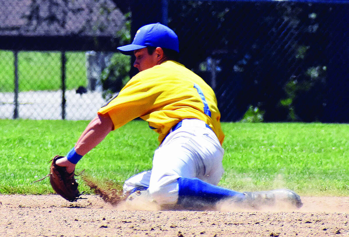 Post 199 shortstop Tate Wargo makes a diving stop in the hole to lead to a force out at second base on Satuday in Aviston.
