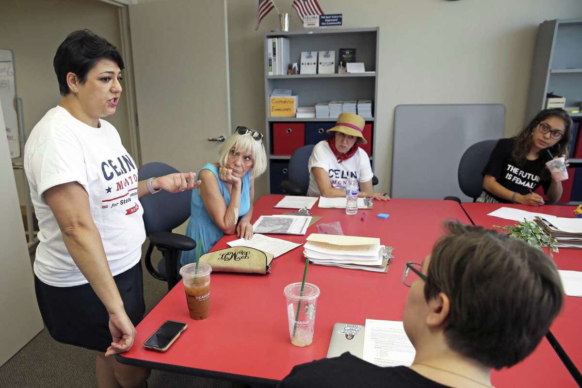 Celina Montoya offers last minute instructions to campaign workers preparing to walk blocks on the north side as Democrats in red districts in San Antonio mount their campaigns to take state office on July 14, 2018.