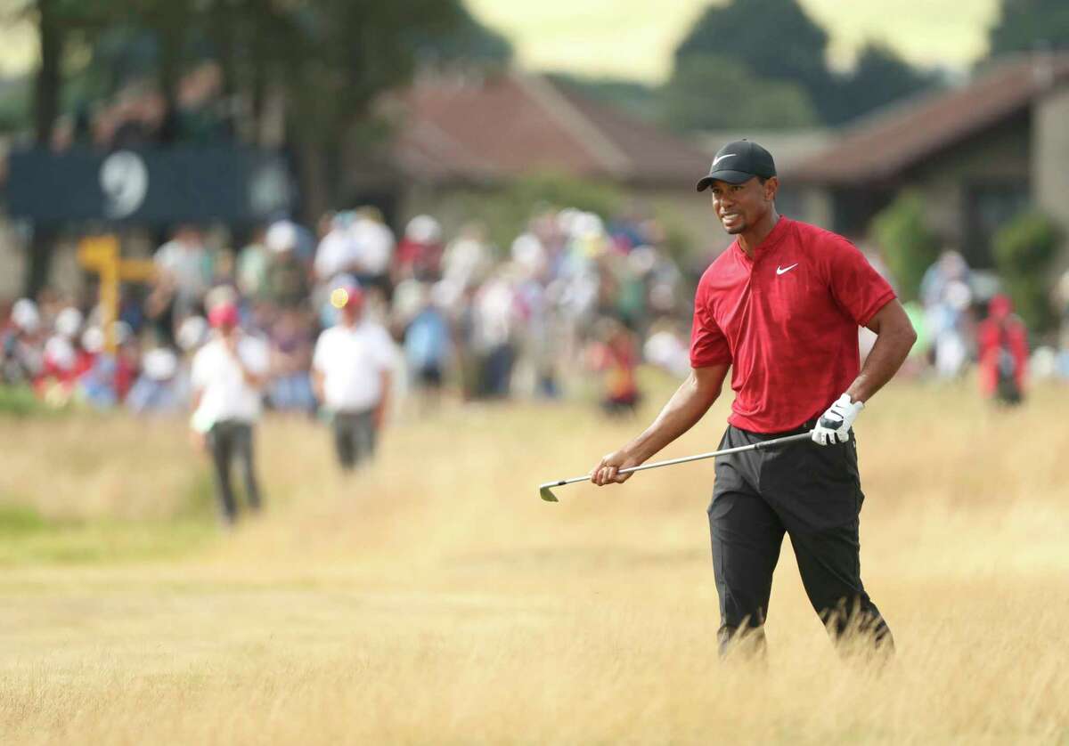 Tiger Woods of the US plays a shot on the 12th hole during the final round of the British Open Golf Championship in Carnoustie, Scotland, Sunday July 22, 2018. (AP Photo/Peter Morrison)