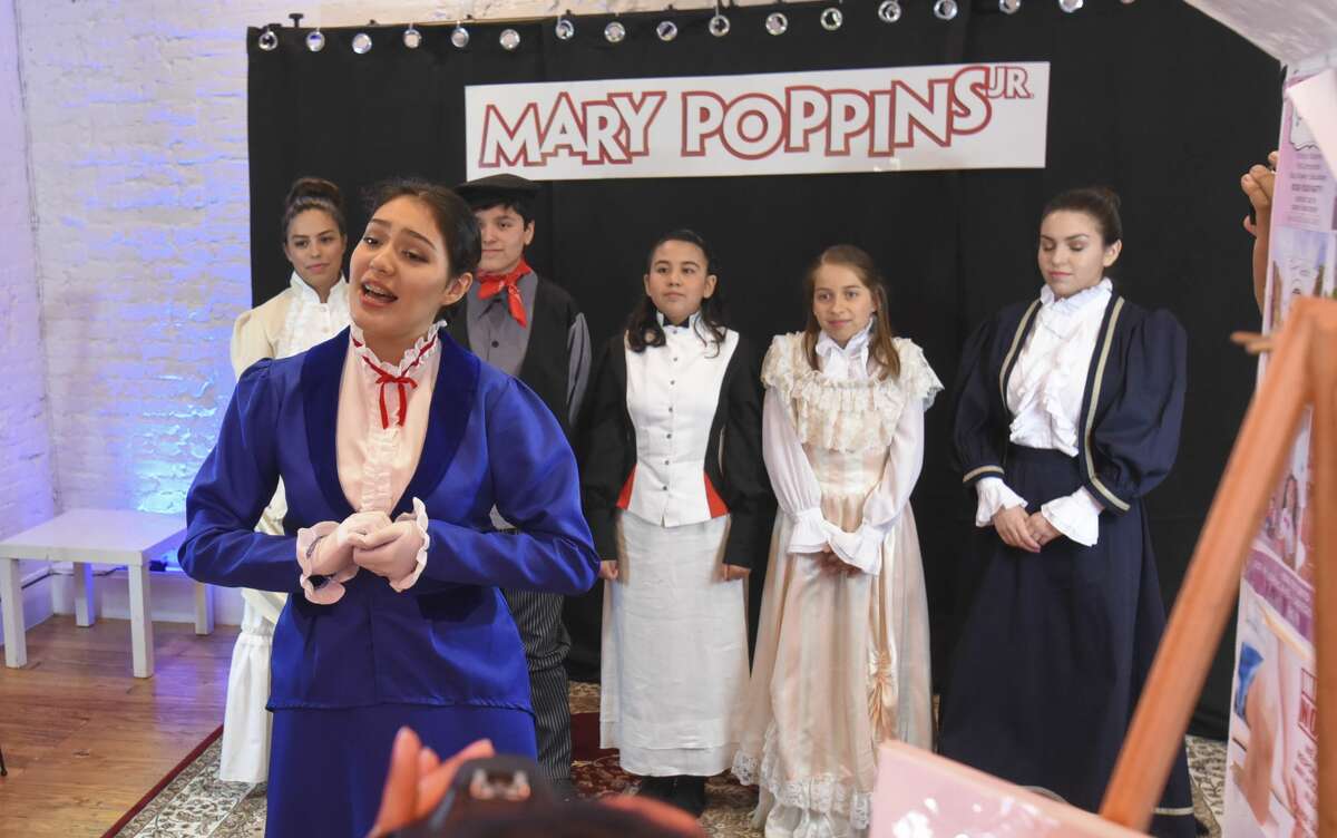 Mary Poppins Jr. cast members sing a selection of songs from the upcoming play during a meet and greet event.