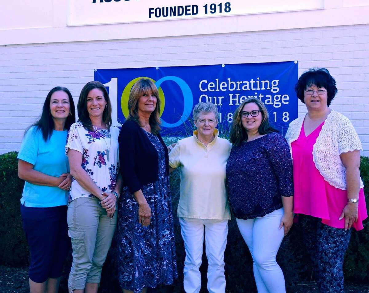 The New Milford Visiting Nurse Association will celebrate its 100th anniversary with a family-friendly celebration Aug. 3 on the Village Green. Among those planning the event are, from left to right, Lyn Sullivan, intake coordinator; Lisa Maciel, clinical nurse manager; Kerri Brinckerhoff, executive director/CEO, New Milford VNA & Hospice; Dawn MacNutt, social worker/geriatric care maanger; Nichole Brandt, VNA Home client care coordinator; and Deborah Sowerby, NMVNA & Hospice billing coordinator. Missing are Michael Stone, program director of VNA Home; Kelsey Collins, scheduling coordinator of VNA Home; Melissa Gmuer, administrative assistant of VNA Home; Sue Stratman, NMVNA & Hospice office assistant; Sarah Smith-Mott, NMVNA & Hospice Hospice volunteer coordinator; Kathy Leier, Hospice Team Leader at NMVNA & Hospice; Gen Pelliciari, NMVNA & Hospice occupational therapist; and Ann Cook, program director of the Nurturing Families Program.