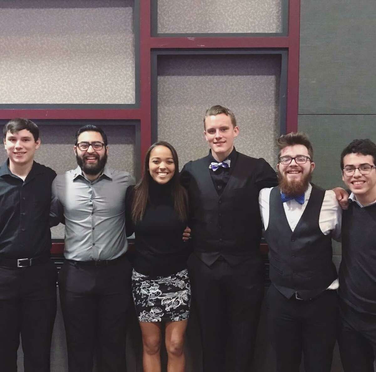 Dru Estes poses for a photo in 2016 with the bassline from the Texas State Bobcat Marching Band. Estes, second from the right, stands next to his friend, Michael Holubec, center. Estes, 20, is among those who were killed in a massive fire at the Iconic Village Apartments in San Marcos on Friday, July 20, 2018, his family said on social media.