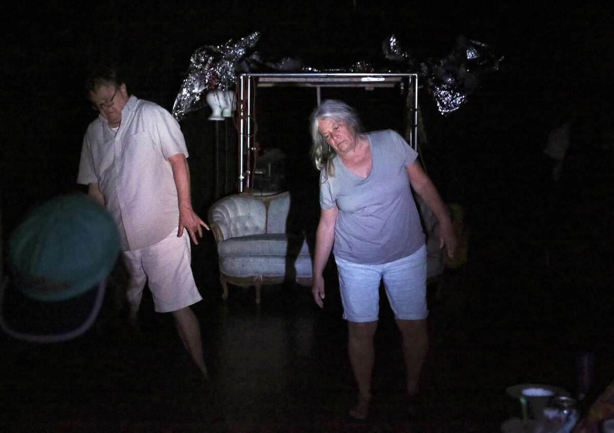 Chuck Squier and Kim Corbin stagger a bit in their roles as ghosts in “Basement Complex Suite 102,” a new work being staged by Jump-Start Performance Co.