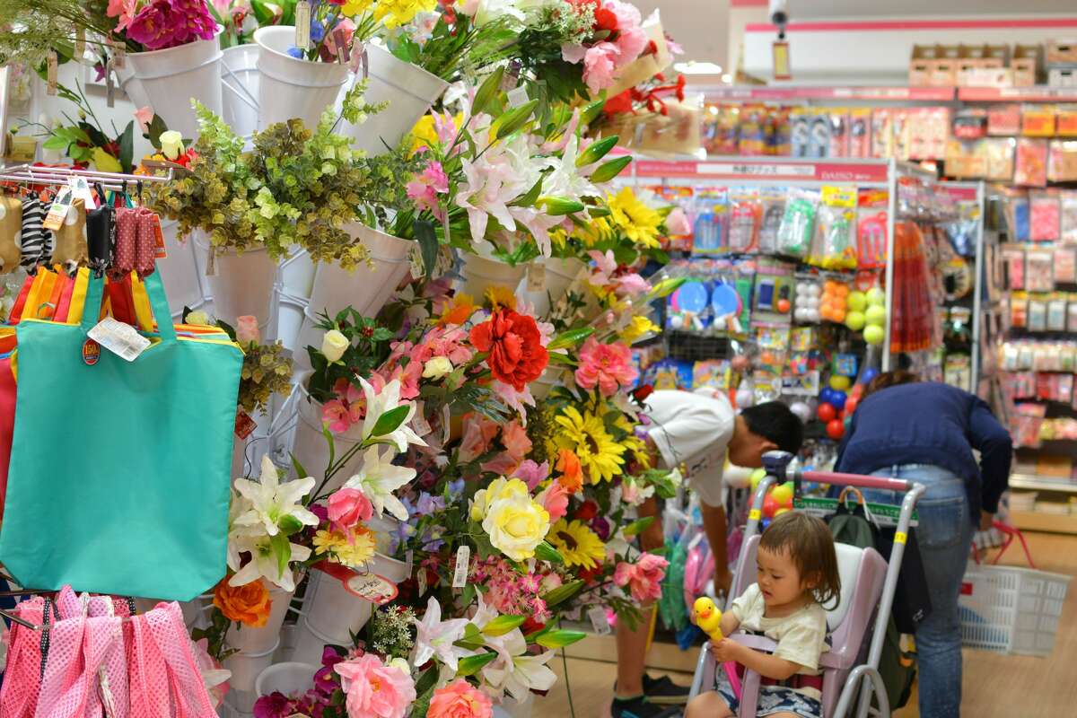 A woman shops at a Daiso in Tokyo on June 20, 2016.