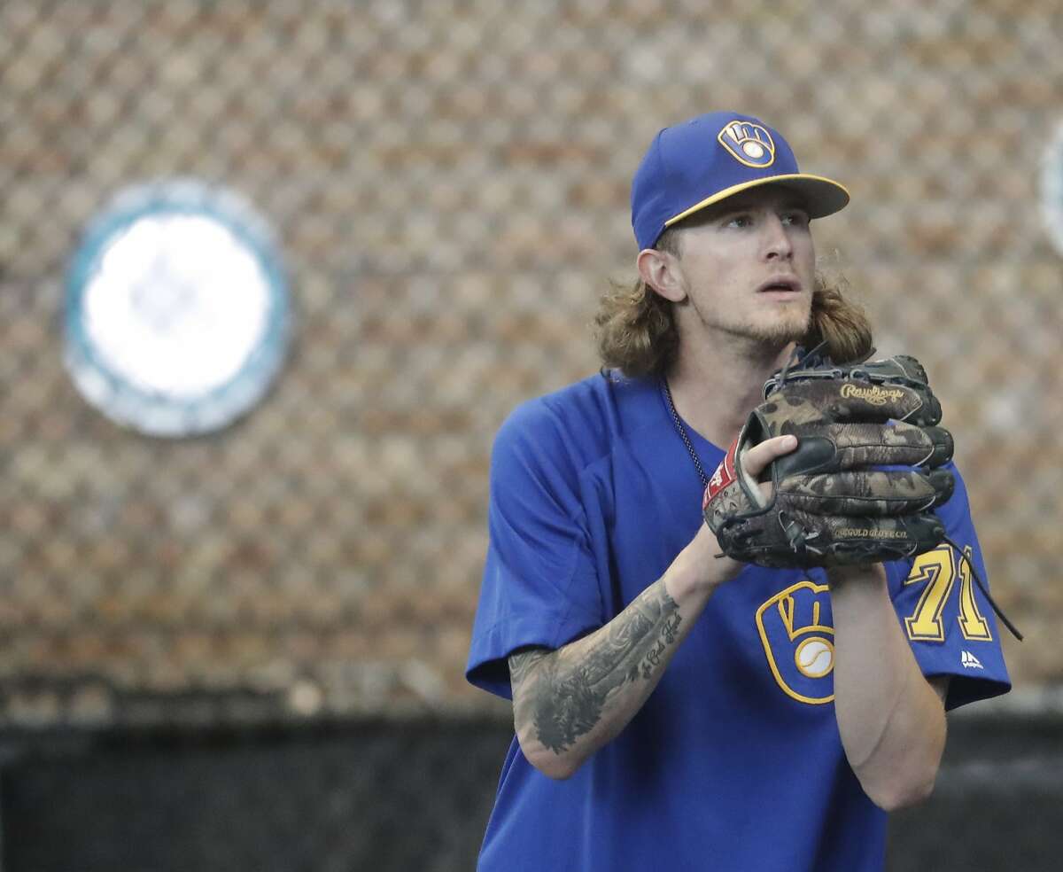 Milwaukee Brewers relief pitcher Josh Hader warms up before a baseball game against the Los Angeles Dodgers Friday, July 20, 2018, in Milwaukee. (AP Photo/Morry Gash)