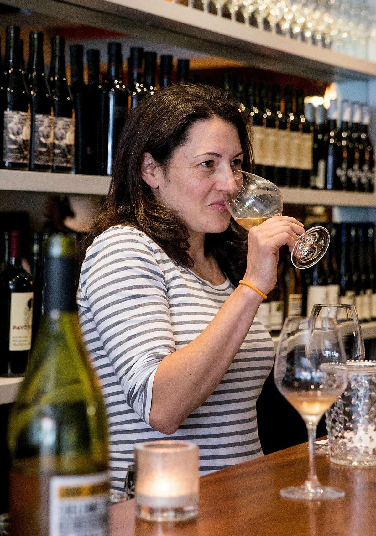 Wine director Sarah Trubnick tastes potential new wines with a seller at Parigo in the Marina district of San Francisco, Calif. Thursday, July 19, 2018.