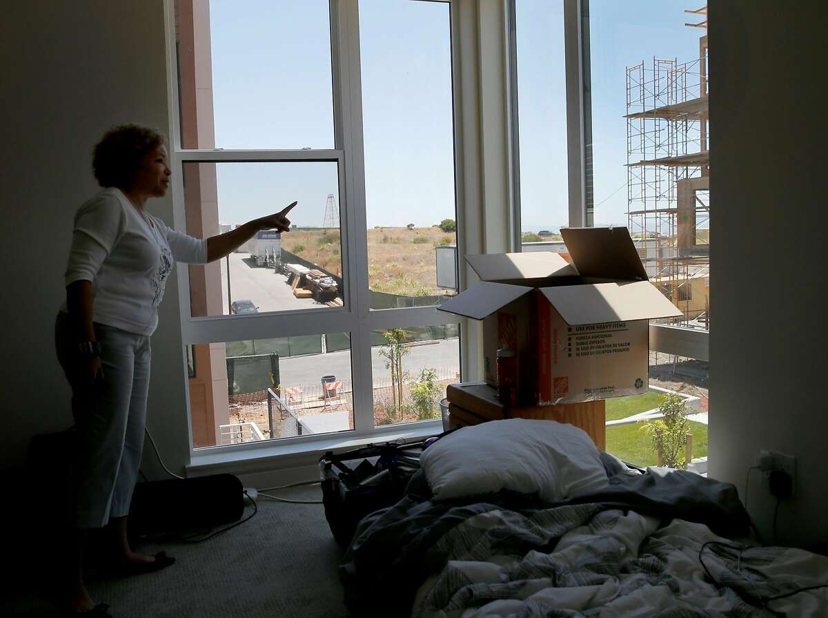Linda Parker Pennington looks out the window of her new three bedroom home Monday June 8, 2015. 88 new housing units are being built and some have moved in to the former Hunters Point Naval Shipyard in San Francisco, Calif. This cleaned up Superfund site is now welcoming the new homeowners.