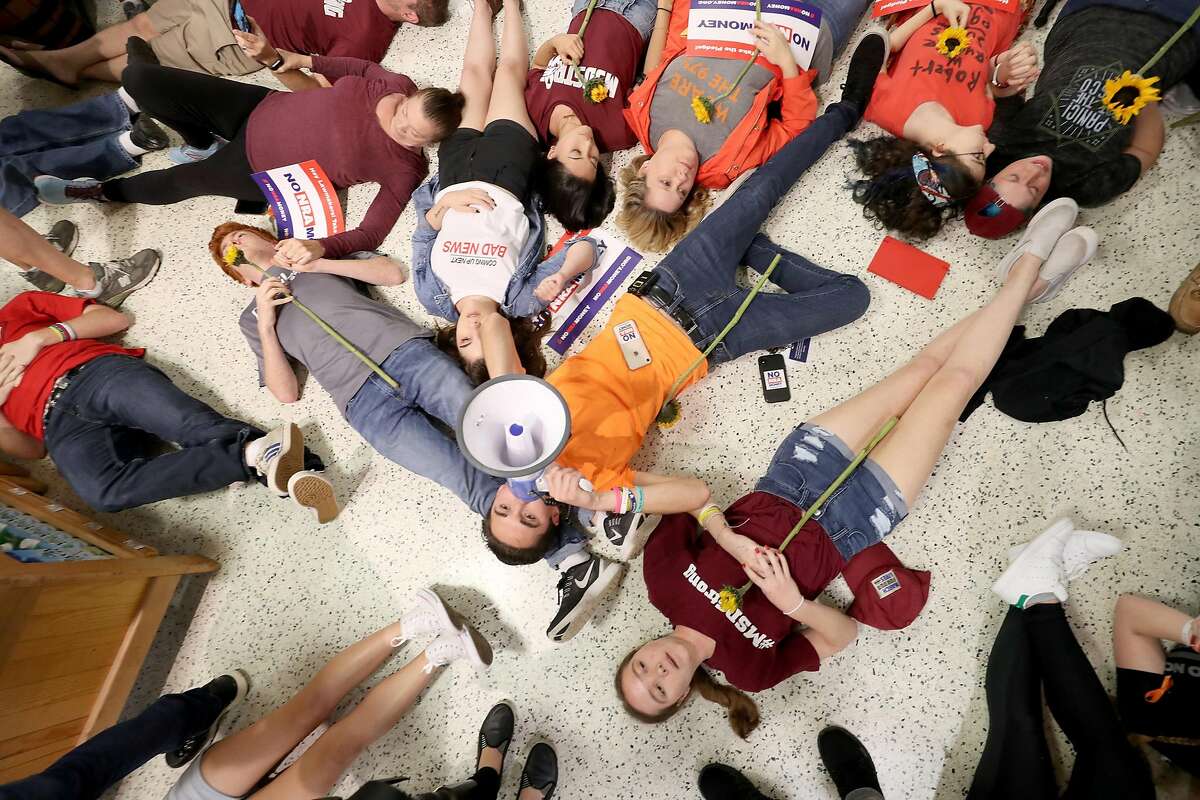 Protesters stage a "die in" at the Publix on Coral Ridge Drive on May 25, 2018 in Coral Springs, Fla. The protests were held after the massacre at Marjory Stoneman Douglas High School and centered on the chains donations to gubernatorial candidate and NRA supporter Adam Putnam. It has been reported that Putnam had received $670,000 over the past three years from the employee-owned corporation. (Mike Stocker/Sun Sentinel/TNS)