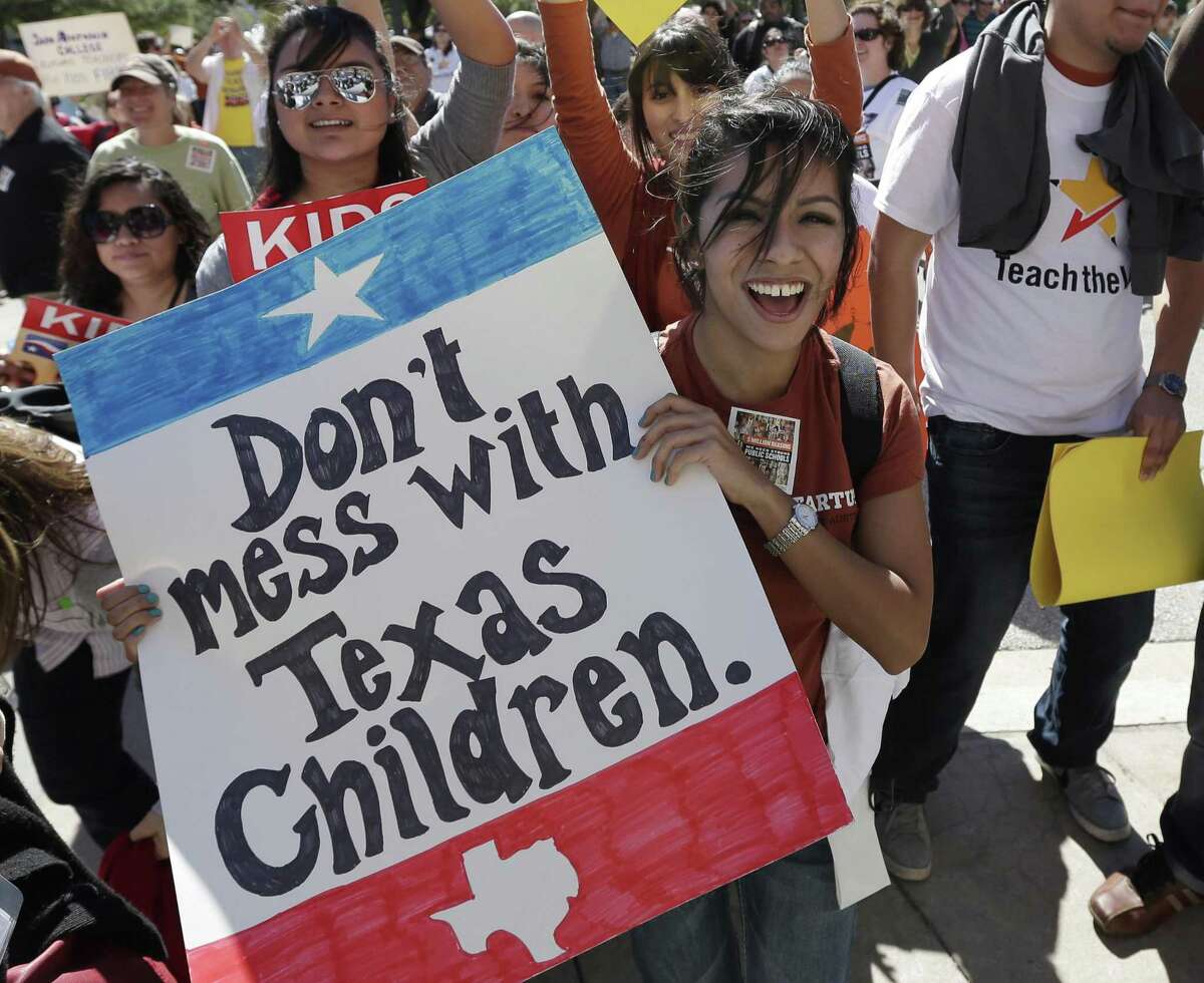 Teachers, students, parents and school administrators take part in a rally for Texas public schools at the state Capitol, Saturday, Feb. 23, 2013, in Austin, Texas.