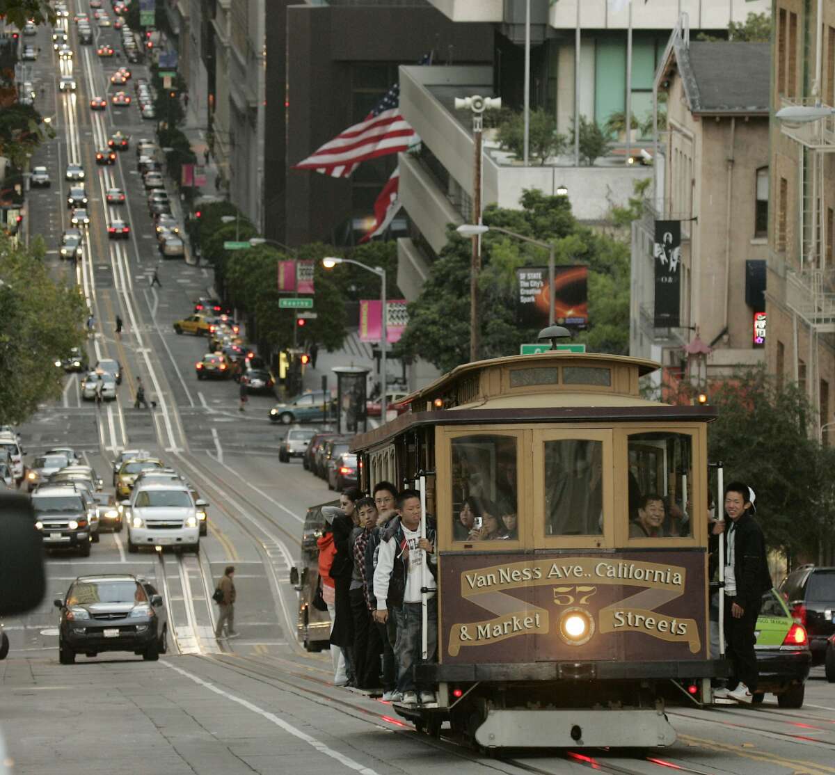 A cable car makes its way up a steep hill on California St. in San Francisco, Wednesday, Oct. 8, 2008. The California cable car line is the least crowded of the three working lines and is the one most often used by locals. (AP Photo/Marcio Jose Sanchez)