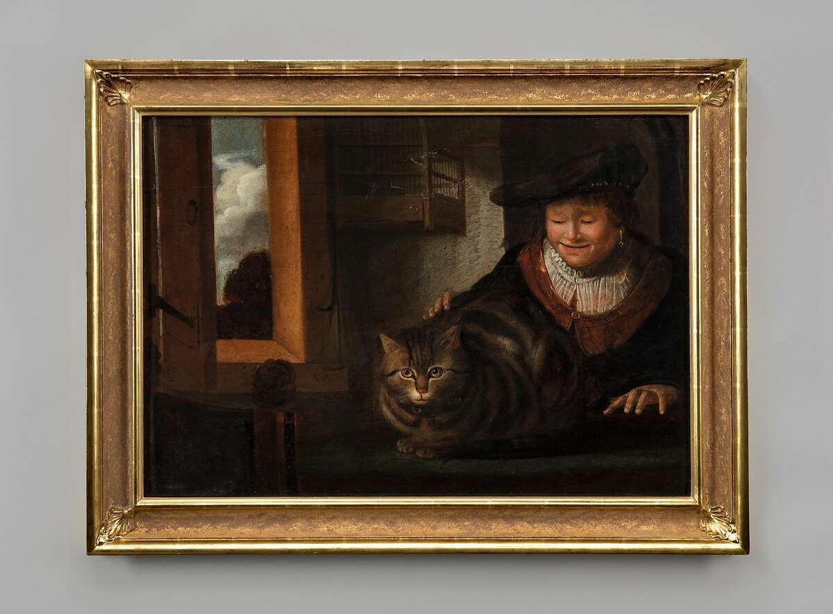 'A Man Stroking a Cat in an Interior' by a follower of Rembrandt van Rijn, 17th century. From 'Caticons',