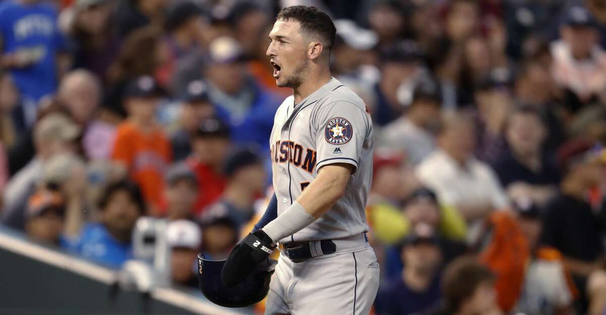 Houston Astros' Alex Bregman reacts after his triple was negated by a call of fan interference when Colorado Rockies left fielder Gerardo Parra tried to catch the ball during the sixth inning of a baseball game Wednesday, July 25, 2018, in Denver. (AP Photo/David Zalubowski)