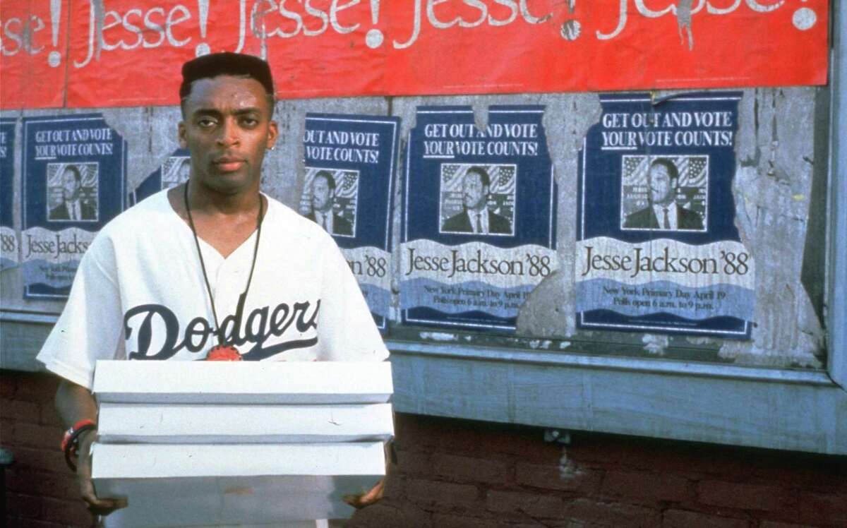 Spike Lee is Mookie in a scene from his 1989 film “Do The Right Thing,” which he also directed, wrote and produced. It was Lee’s first masterpiece.