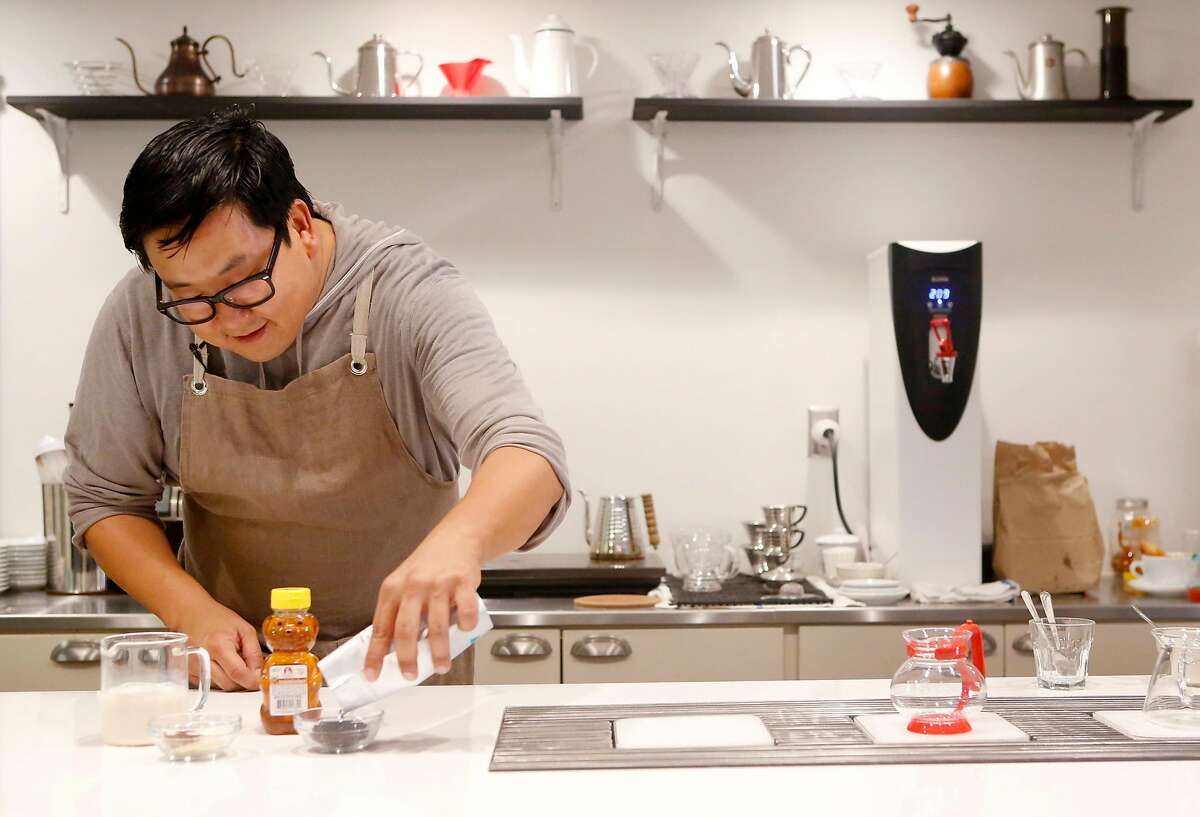 Nick Cho pours out tea to steep at Wrecking Ball Coffee in San Francisco Wednesday October 13, 2015.