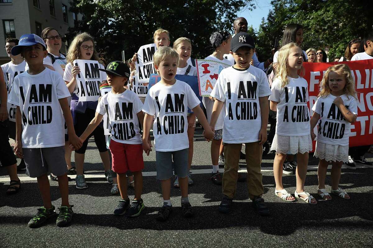 WASHINGTON, DC - JULY 26: Protesters and their children participate in a march prior to a sit-in in the Hart Senate Office Building to mark the court-ordered deadline for the Trump Administration to reunify thousands of families separated at the border July 26, 2018 in Washington, DC. Members of the The groups protesting, the Families Belong Together Coalition and the National Domestic Workers Alliance and children and families, protested ?’to demand an immediate reunification of all families and an end to family detention.?“ (Photo by Win McNamee/Getty Images)