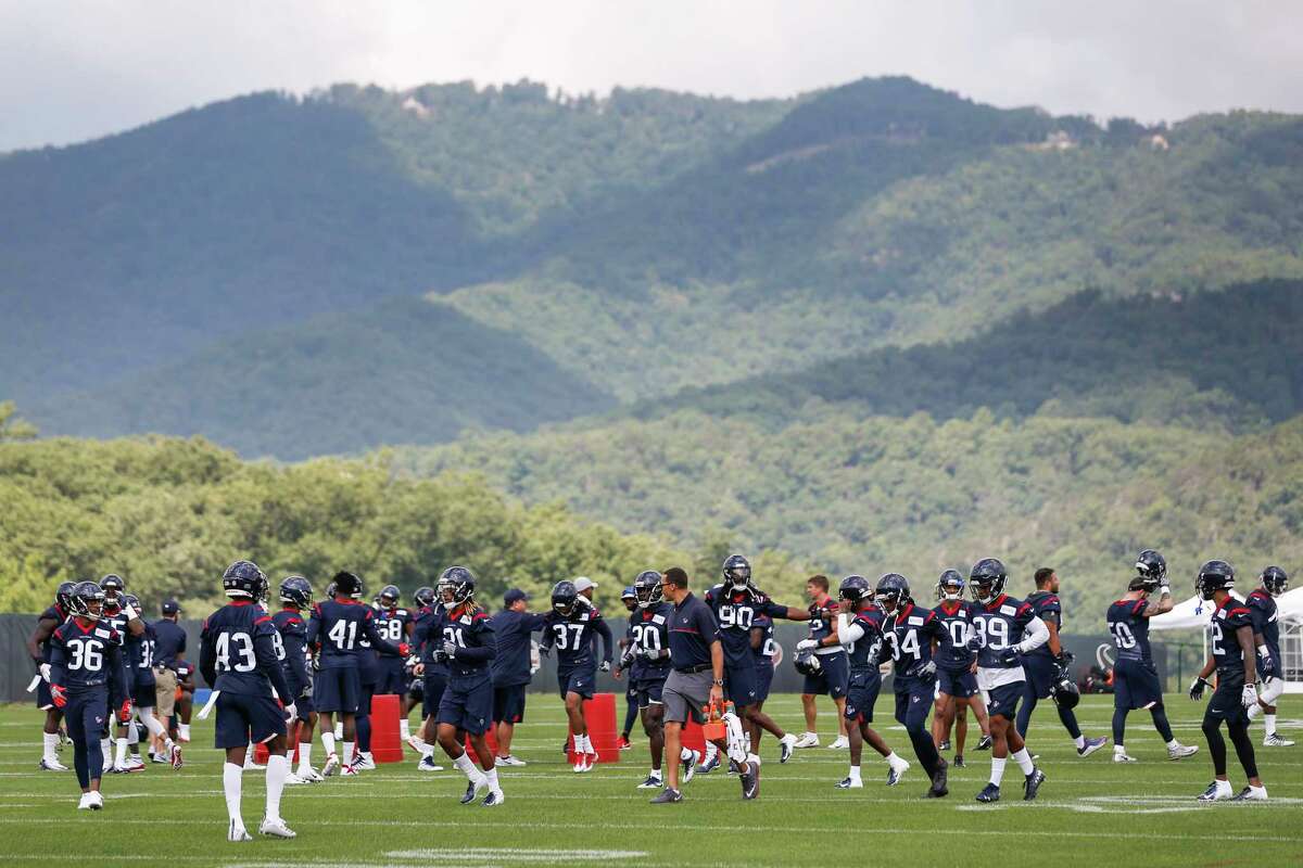 The Houston Texans defense gathers on the field for the start of training camp at The Greenbrier Sports Performance Center on Thursday, July 26, 2018, in White Sulphur Springs, W.Va.