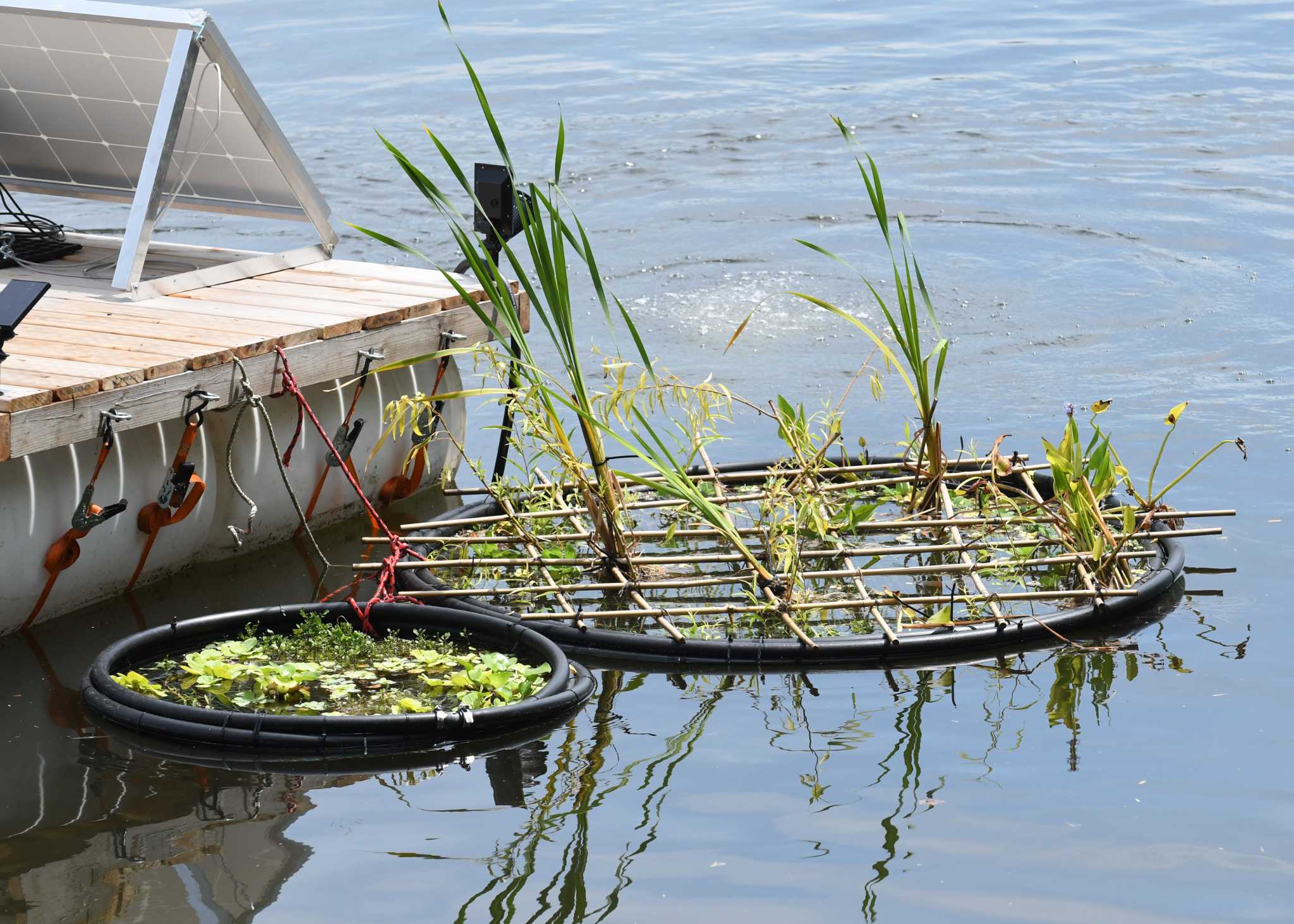 Fishermen use homemade styrofoam floating devices as boats