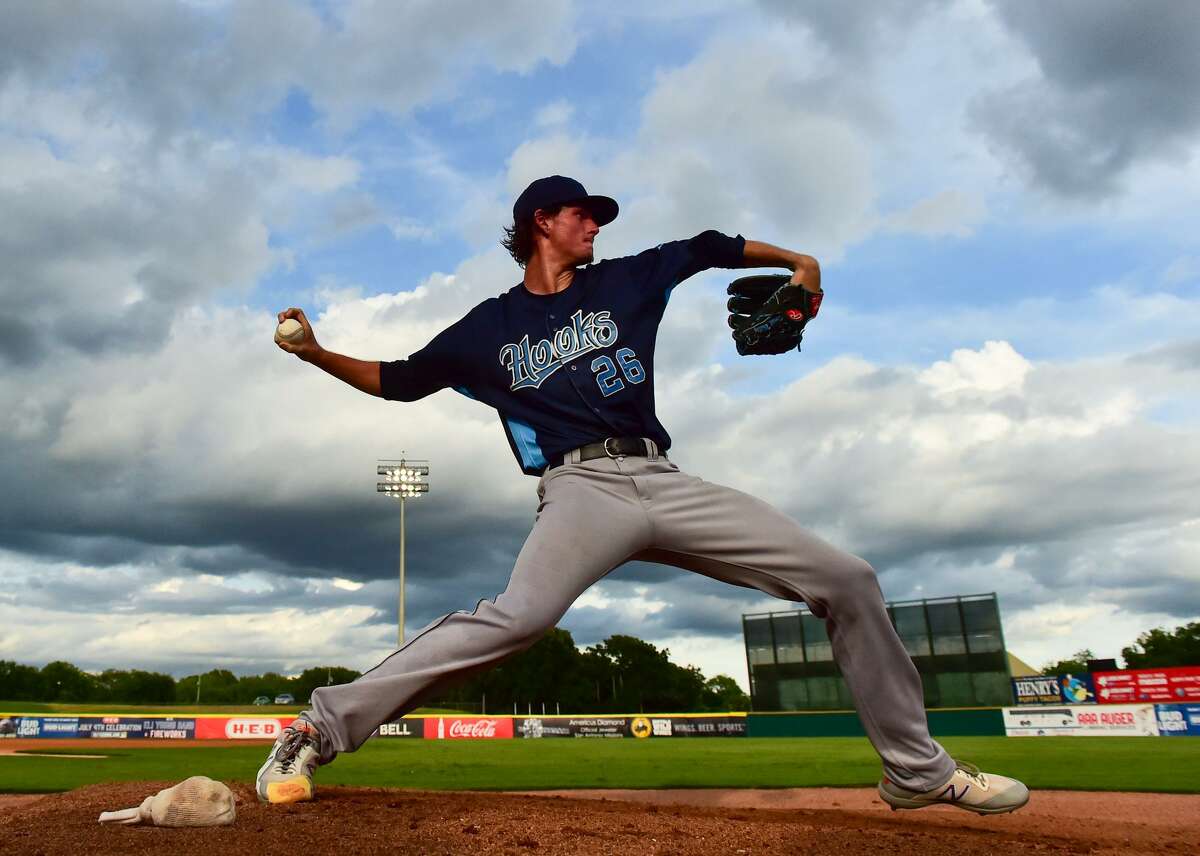 Forrest Whitley of the Corpus Christi Hooks warms up during his return to San Antonio to face the Missions Monday night