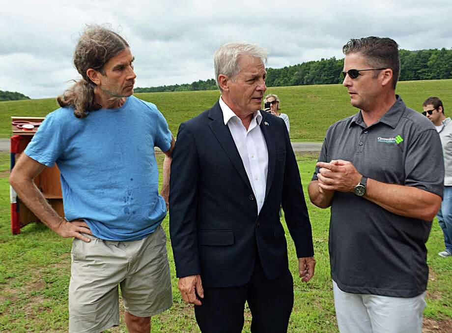 From left, Jeff Hush, member of the city’s Clean Energy Task Force; state Sen. Len Suzio, R-Meriden; and James Desanatos, vice president of Business Development & Government Relations at Greenskies Renewable Energy of Middletown; gathered Thursday to inaugurate the solar array installed in June on city property adjacent to the Higby Water Treatment Facility on the Middletown line. Photo: Cassandra Day / Hearst Connecticut Media