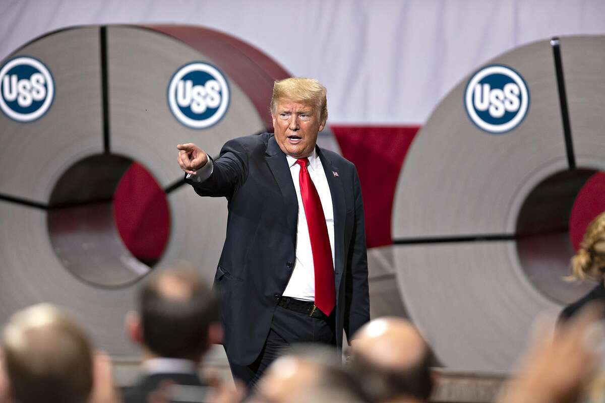 U.S. President Donald Trump points toward the audience after speaking at the U.S. Steel Corp. Granite City Works facility in Granite City, Illinois, U.S., on Thursday, July 26, 2018. According to the AP, Trump on Thursday trumpeted the renewed success of the steel mill, pushing back against criticism that his escalating trade disputes are hurting American workers and farmers. Photographer: Daniel Acker/Bloomberg