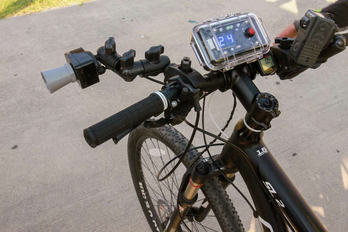 The C3FT unit, mounted on the bicycle's handlebars, records distance of passing motorists from the bicycle. The sensor on the left, reads the distance and the unit on the right shows the distance of the passing vehicle from the bike's handlebars. The system also has a camera that records a photo of the passing vehicle. HPD demonstrated the unit which will be used to help enforce the Safe Passing ordinance.