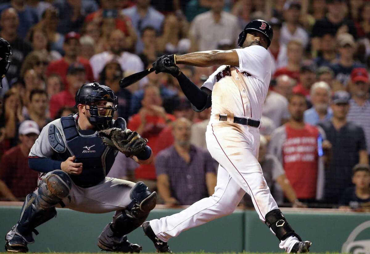 Boston Red Sox's Jackie Bradley Jr. strikes out swinging with the bases loaded in front of Minnesota Twins catcher Bobby Wilson to end a baseball game at Fenway Park, Thursday, July 26, 2018, in Boston. The Twins won 2-1. (AP Photo/Elise Amendola)