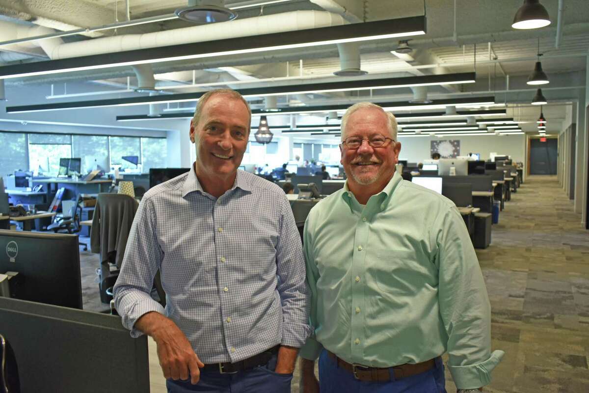 Remedy Partners founder Steve Wiggins, left, alongside CEO Chris Garcia on July 24, 2018, at the health insurance company’s headquarters in Norwalk, Conn.