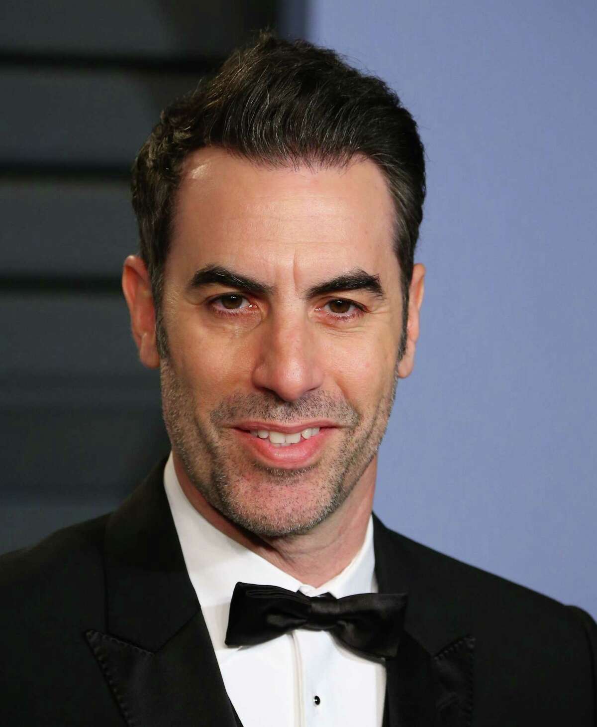 (FILES) In this file photo taken on March 4, 2018, Sacha Baron Cohen attends the 2018 Vanity Fair Oscar Party at The Wallis Annenberg Center for the Performing Arts in Beverly Hills, California. Jason Spencer, a Republican member of the Georgia House of Representatives, is resigning after a humiliating appearance on comedian Sacha Baron Cohen's television show during which he exposed himself and shouted racial slurs. Spencer had been under pressure from his own party to step down following the embarrassing appearance on Cohen's series "Who Is America?" / AFP PHOTO / JEAN-BAPTISTE LACROIXJEAN-BAPTISTE LACROIX/AFP/Getty Images