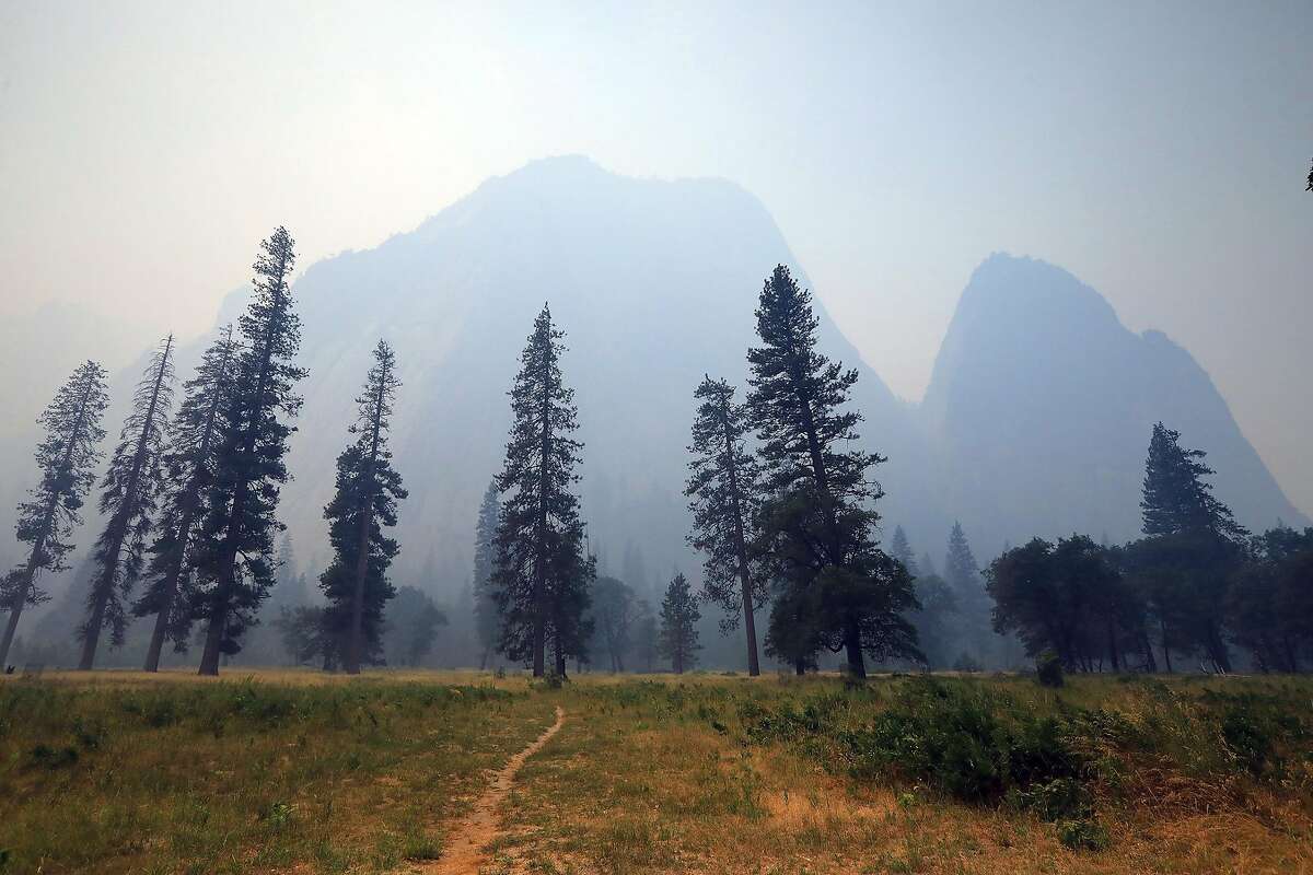 Thick smoke blankets Yosemite Valley in California’s Yosemite National Park, July 26, 2018. Thousands of tourists were evacuated a day earlier, as one of the country’s most iconic natural preserves was blanketed with thick smoke from a 38,000-acre fire. (Jim Wilson/The New York Times)