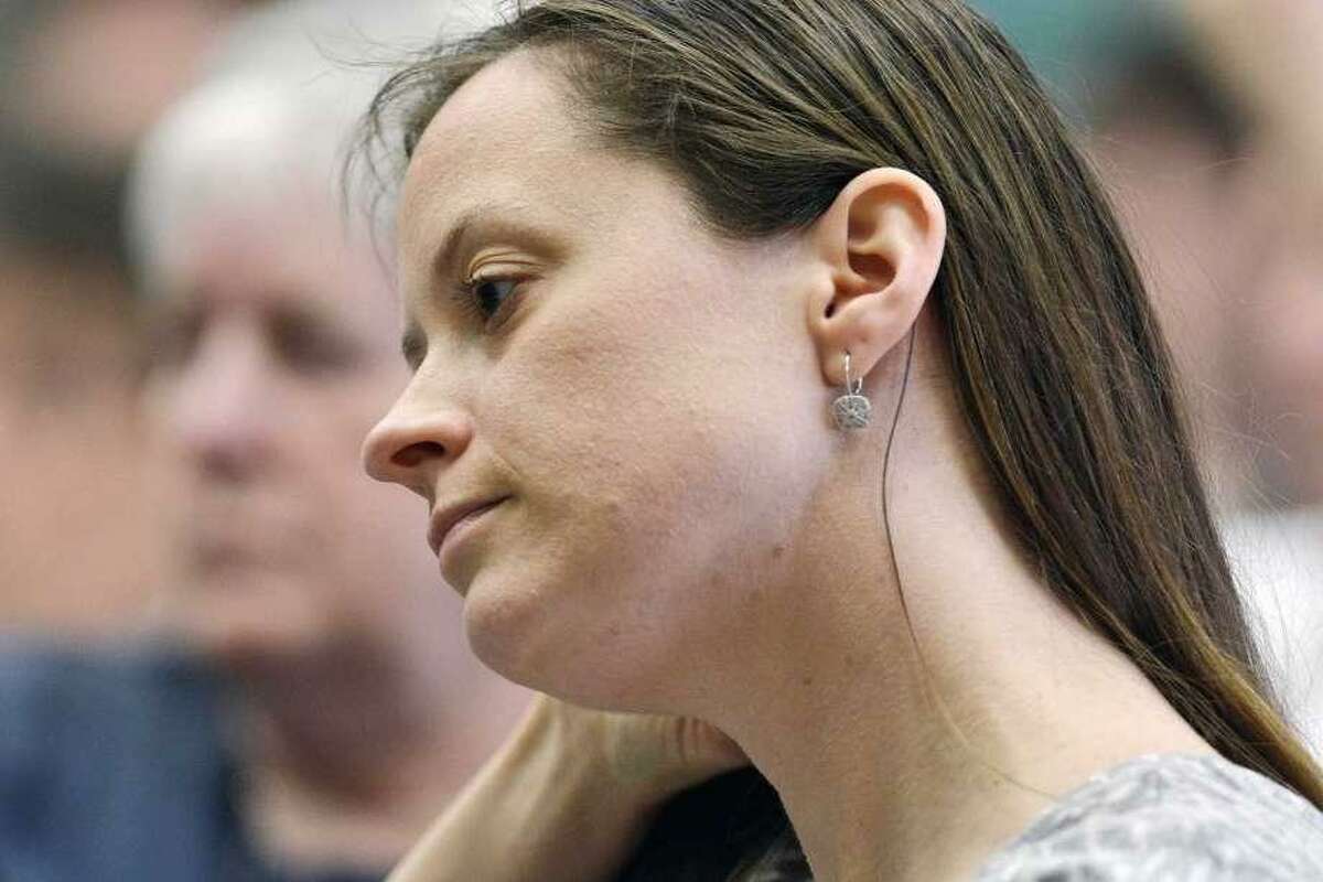 Haddam Selectwoman Melissa Schlag is under fire by many people following her decision to kneel when the Pledge of Allegiance is recited at town meetings.