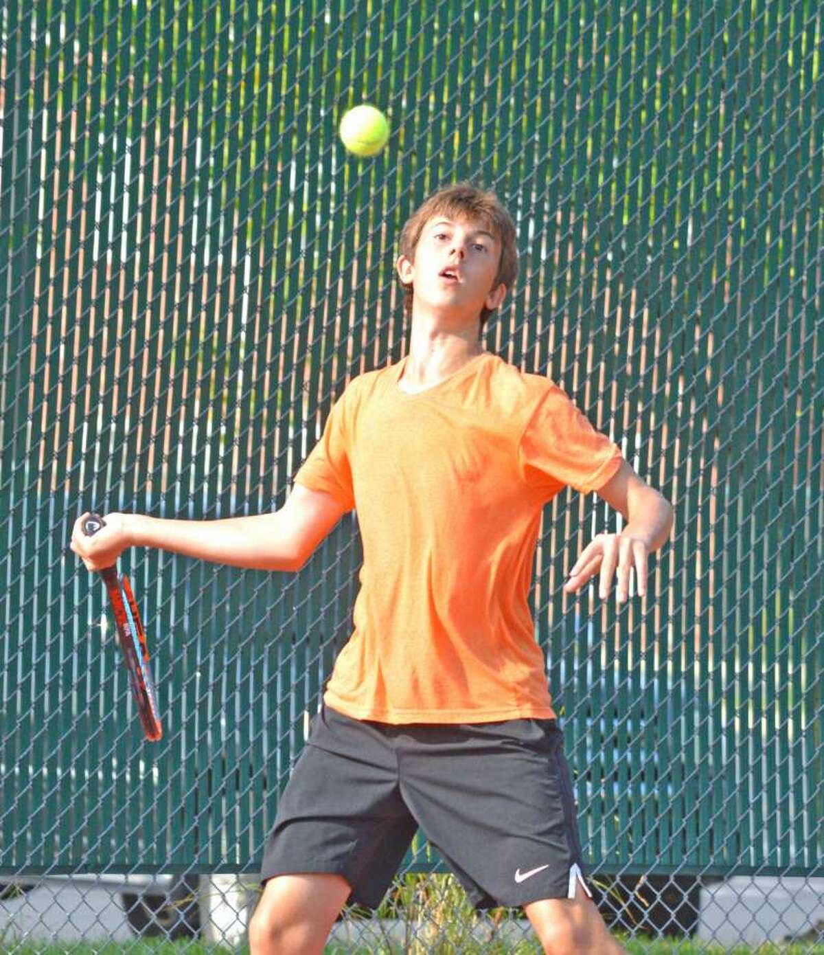 Drake Schreiber, who will be a senior at Edwardsville, makes a forehand return during last year’s Pro Wild Card Challenge at the EHS Tennis Center.