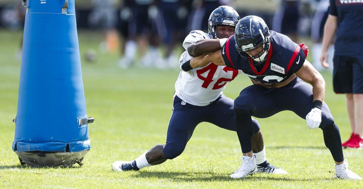 Houston Texans running back Terry Swanson (42) blocks linebacker Brian Peters (52) during training camp at the Greenbrier Sports Performance Center on Saturday, July 28, 2018, in White Sulphur Springs, W.Va.