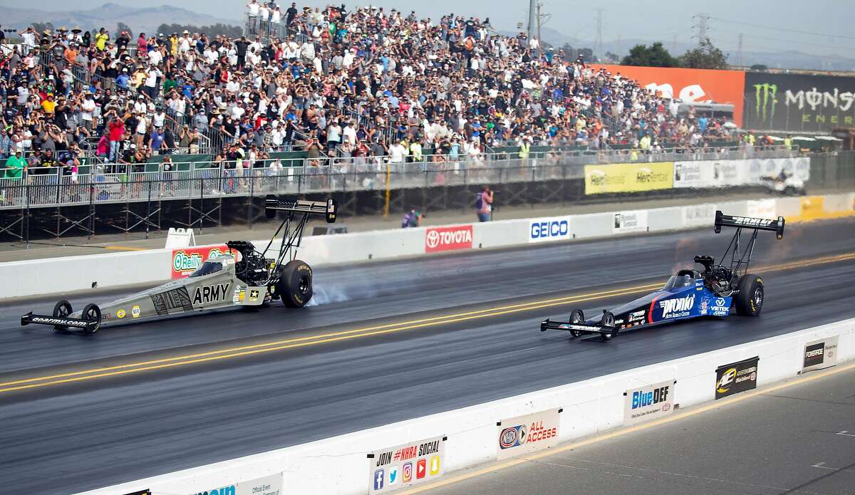Blake Alexander, right, overtakes Tony Schumacher in the championship heat of the Top Fuel competition of the Toyota NHRA Sonoma Nationals at Sonoma Raceway, on Sunday, July 29, 2018 in Sonoma, Calif.