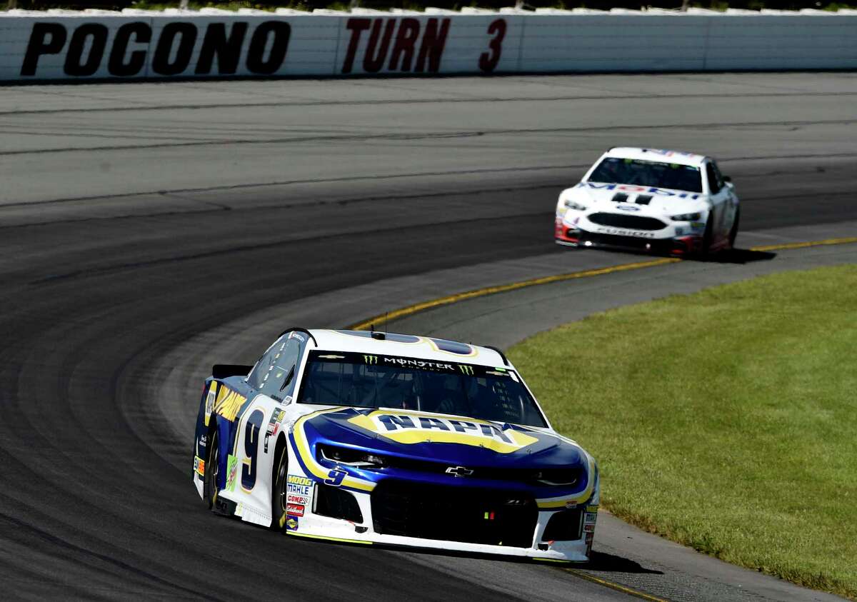 Chase Elliott drives through Turn 3 during a NASCAR Cup Series auto race, Sunday, July 29, 2018, in Long Pond, Pa. (AP Photo/Derik Hamilton)