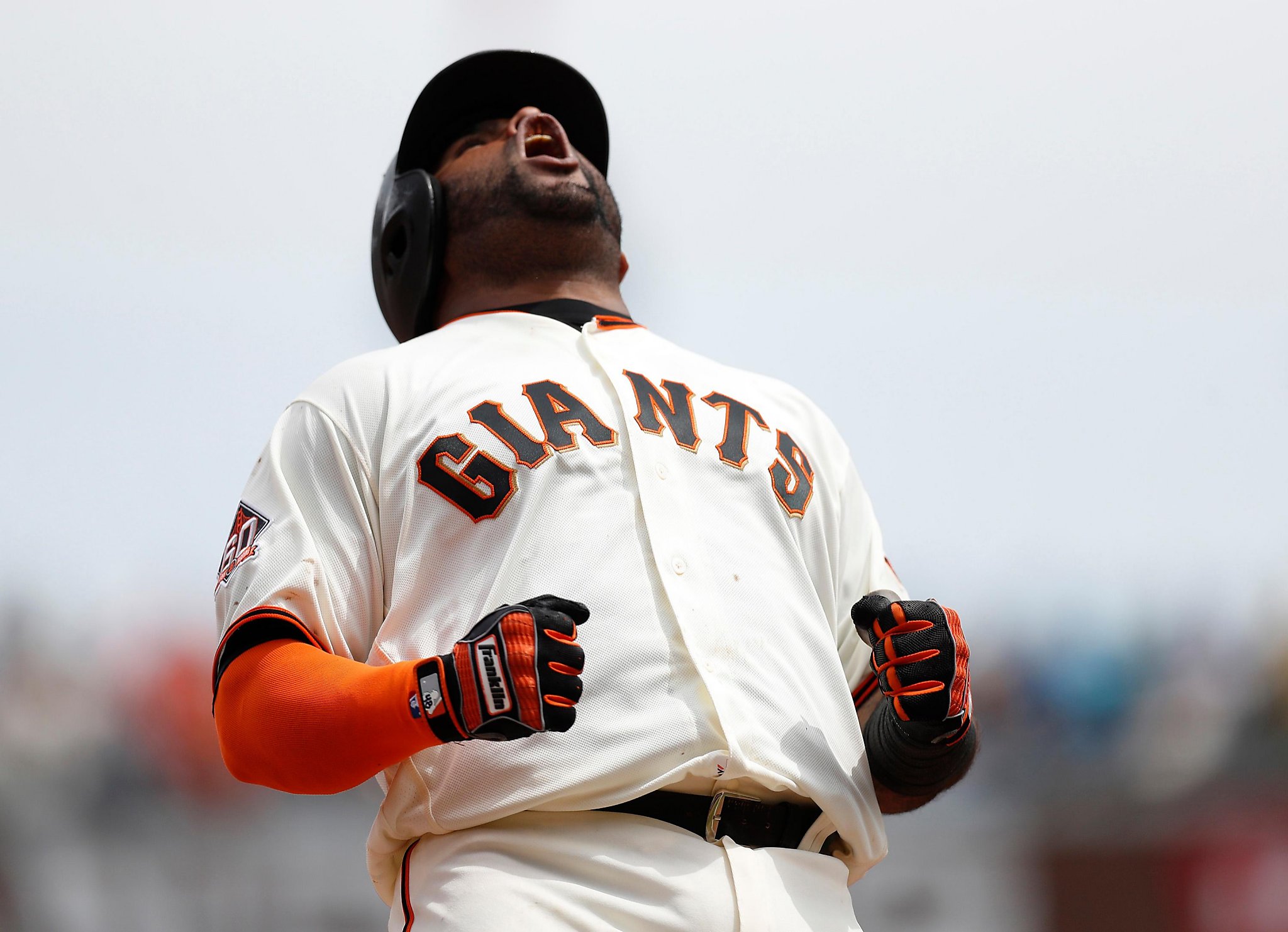 Giants Pablo Sandoval slides into third base in the fourth inning