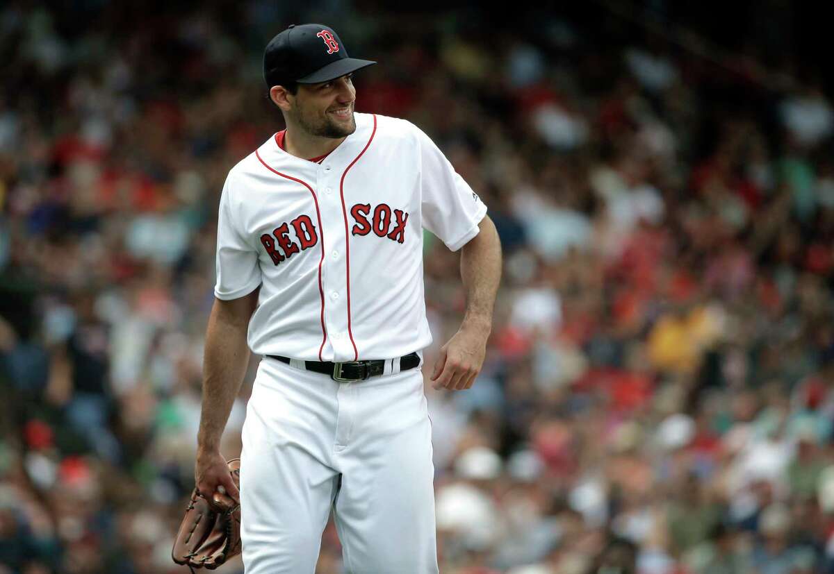 Boston Red Sox's Nathan Eovaldi smiles as he steps off the mound after pitching against the Minnesota Twins in the fourth inning of a baseball game, Sunday, July 29, 2018, in Boston. (AP Photo/Steven Senne)
