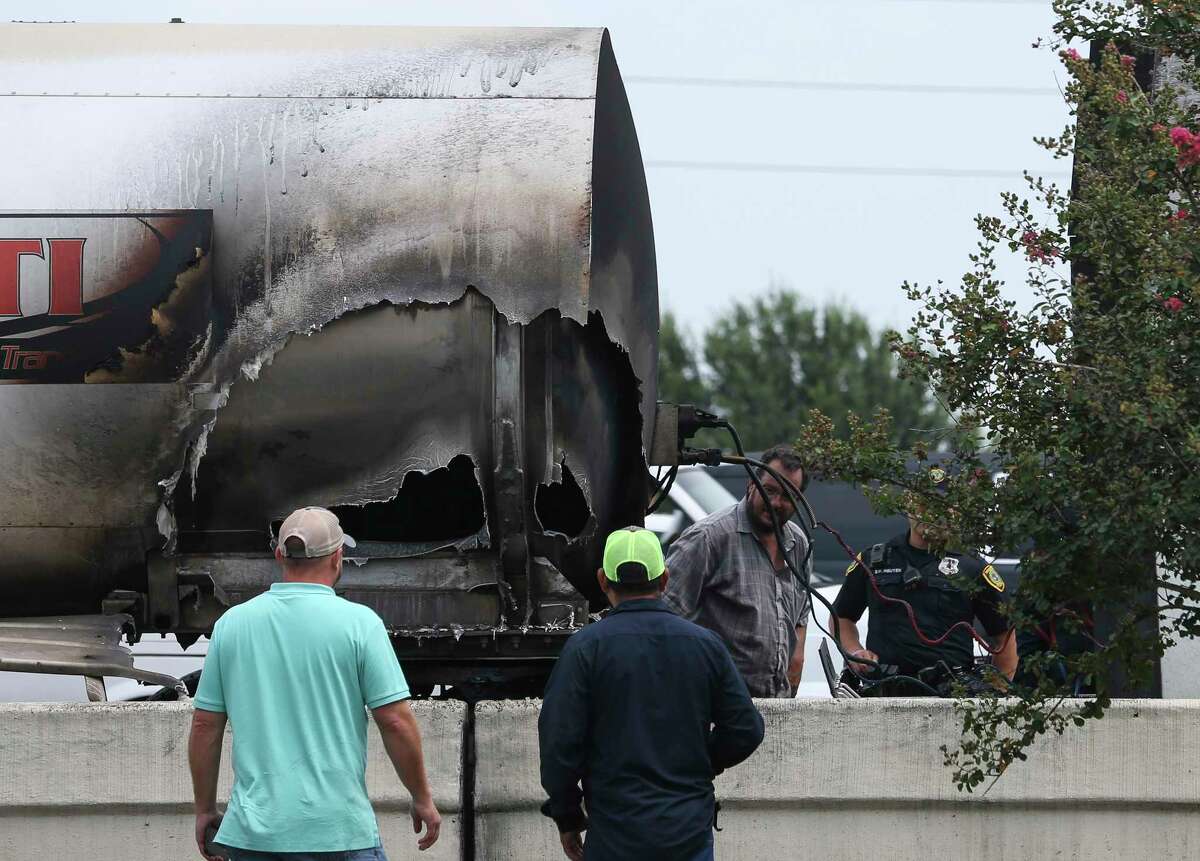 A hole could could be seen from the side of an 18-wheeler caught on Interstate Highway 10 eastbound near Park Ten Boulevard on Monday, July 30, 2018, in Houston. At one point all mainlanes were affected, according to Houston TranStar.