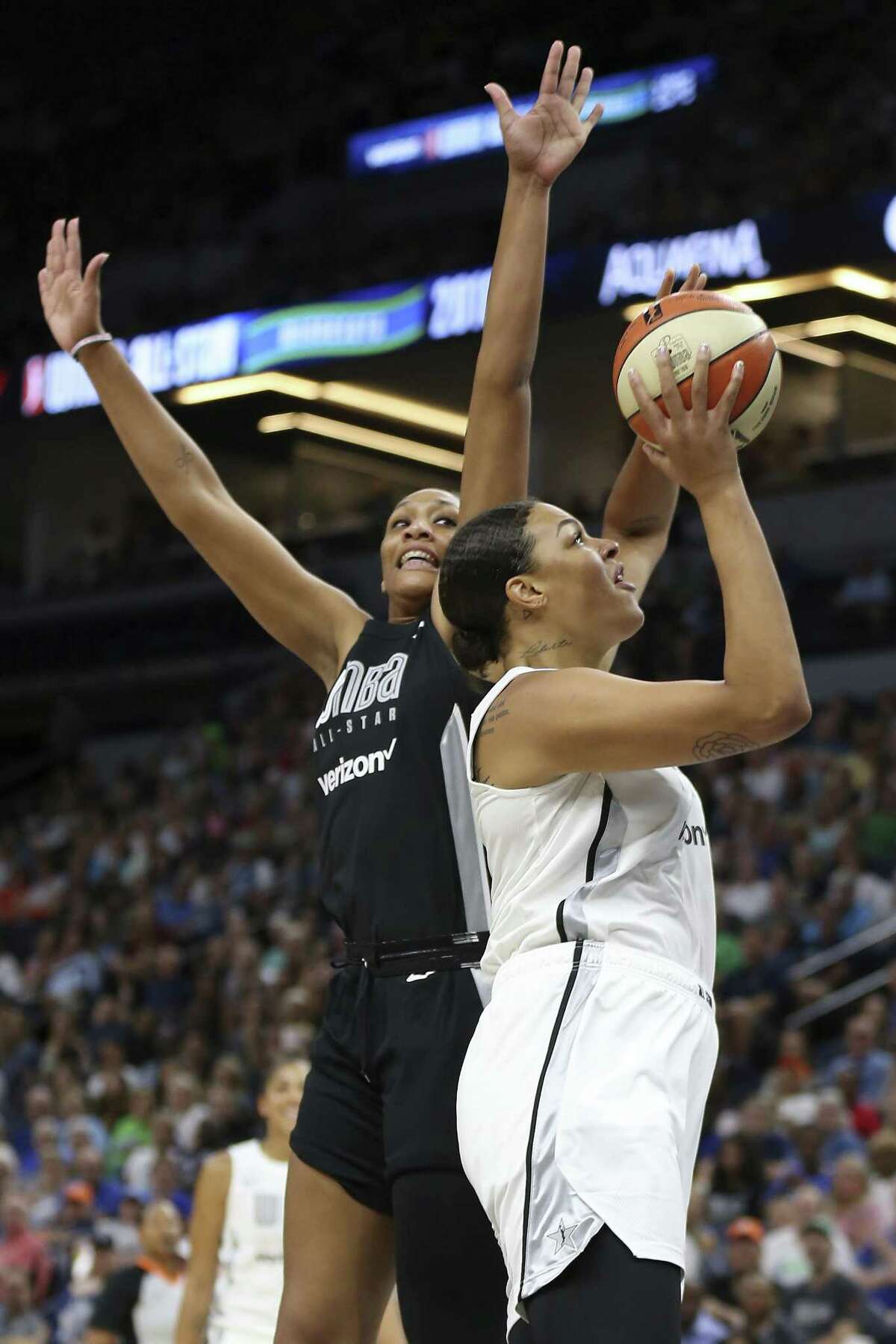 Team Candace Parker's Liz Cambage, right, shoots the ball against Team Delle Donne's A'ja Wilson, left, in the first half of the WNBA All-Star basketball game Saturday, July 28, 2018 in Minneapolis. (AP Photo/Stacy Bengs)