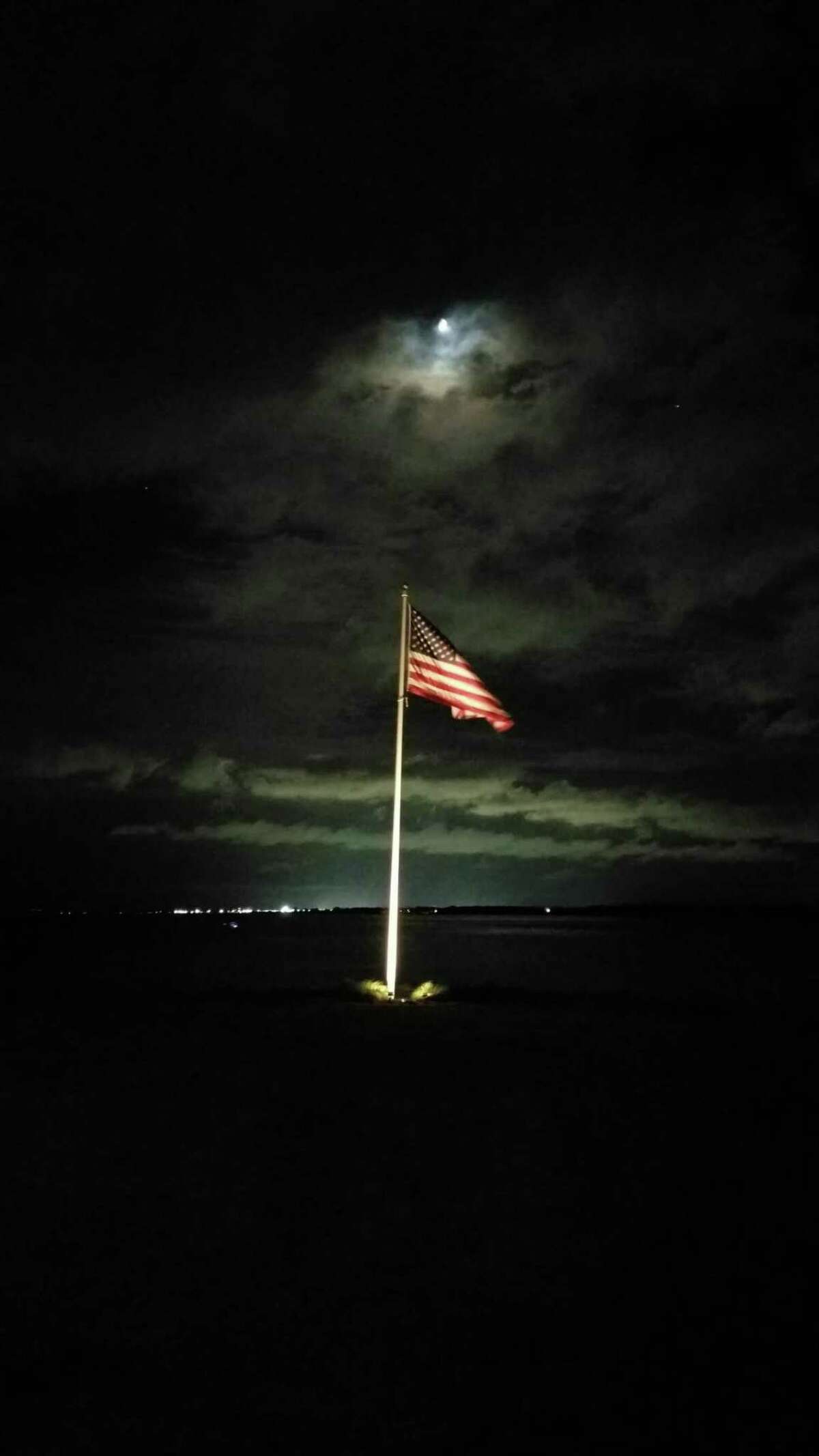 Dean Herrick sends us this photo of an American flag at night taken at the Warwick Country Club, Warwick, R.I. at his niece's wedding. His future son-in-law (Tim Austen) inspired him to take it since he took one just like it before I did.