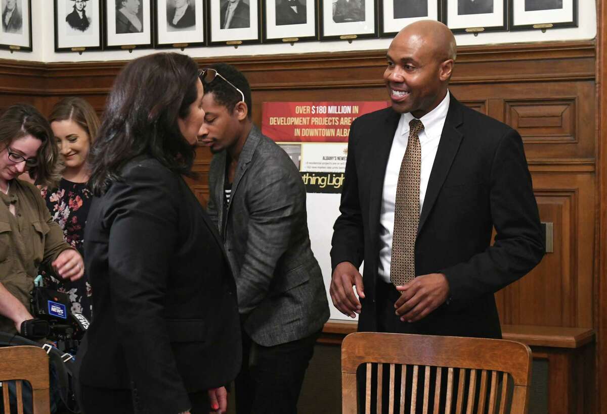 New Police Chief Eric Hawkins, right, talks to Kumi Tucker and other members of the press after Albany Mayor Kathy Sheehan held a press conference to introduce him at City Hall on Monday, July 30, 2018 in Albany, N.Y. (Lori Van Buren/Times Union)