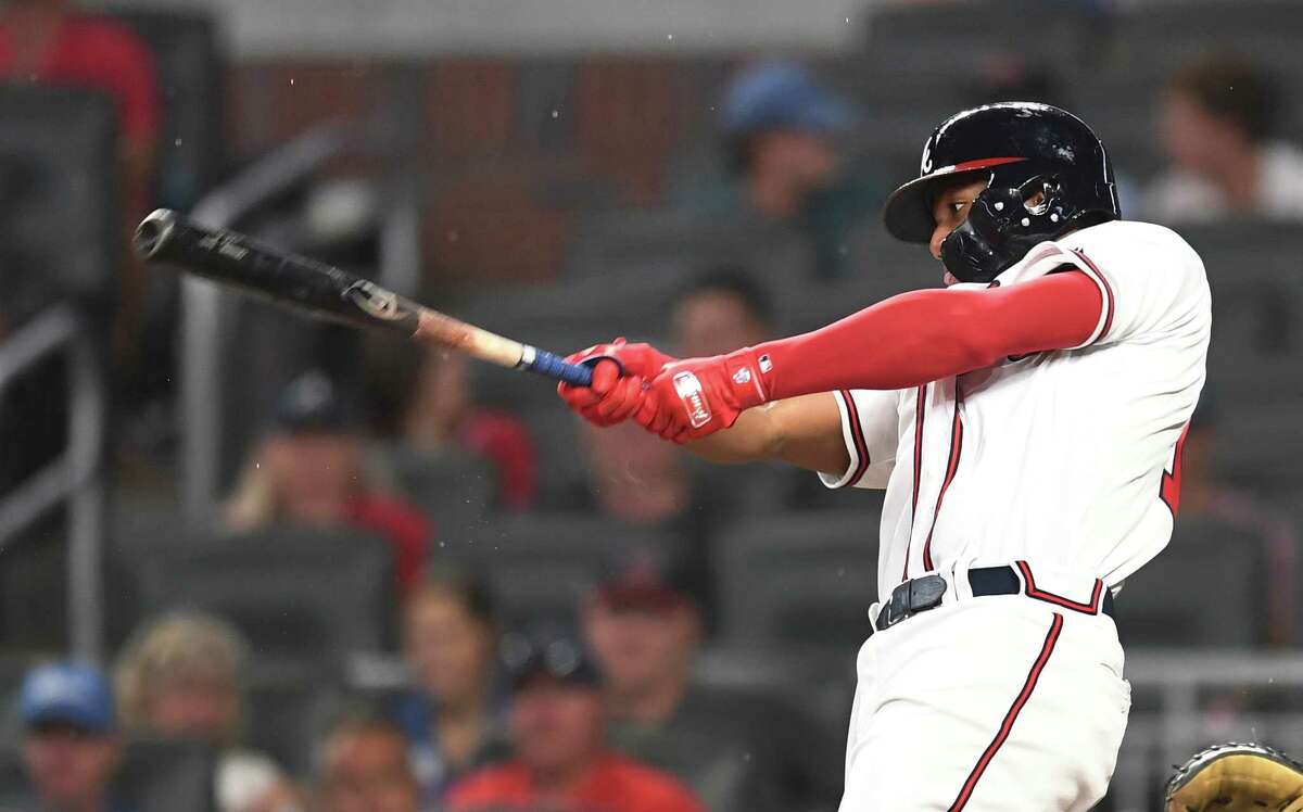 ATLANTA, GA - JULY 30: Ronald Acuna, Jr. #13 of the Atlanta Braves hits a fifth inning solo home run against the Miami Marlins at SunTrust Park on July 30, 2018 in Atlanta, Georgia. (Photo by Scott Cunningham/Getty Images)