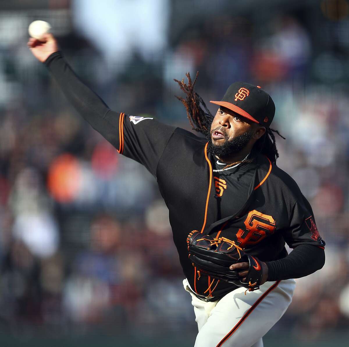San Francisco Giants pitcher Johnny Cueto works against the Milwaukee Brewers in the first inning of a baseball game Saturday, July 28, 2018, in San Francisco. (AP Photo/Ben Margot)