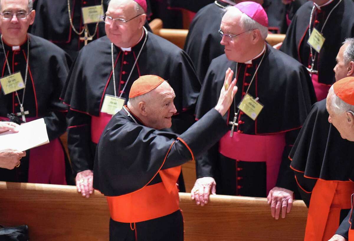 Cardinal Theodore McCarrick waves to fellow bishops at the Cathedral of St. Matthew the Apostle in Washington in September 2015, during Pope Francis's visit.