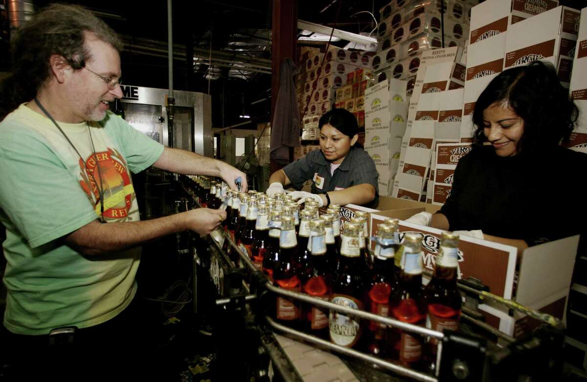 A file photo of Reed’s founder Chris Reed on his company’s former Los Angeles ginger beer production line. Reed’s announced on July 31, 2018 the relocation of its headquarters to Norwalk, Conn. after the sale of the Los Angeles plant. (AP Photo/Damian Dovarganes)